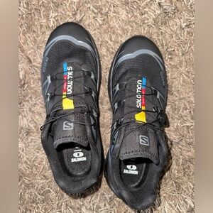 Salomon Black Trail Running Shoes with Red Accents